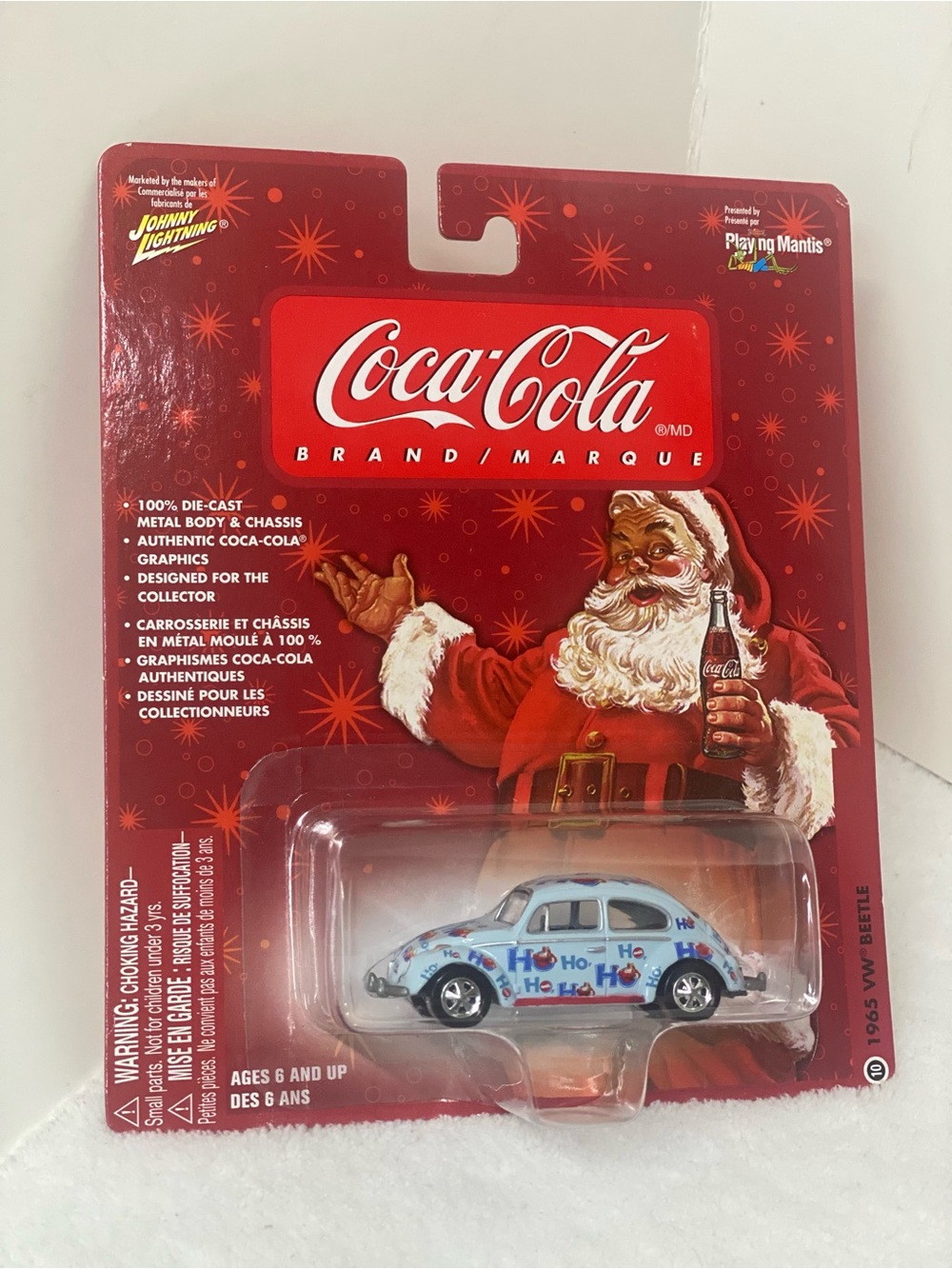 Johnny Lightning Die Cast 1965 Volkswagen Beetle Coca Cola Brand Ho Ho Ho on Car